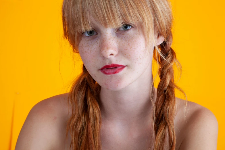 a beautiful young woman with red hair and orange lipstick