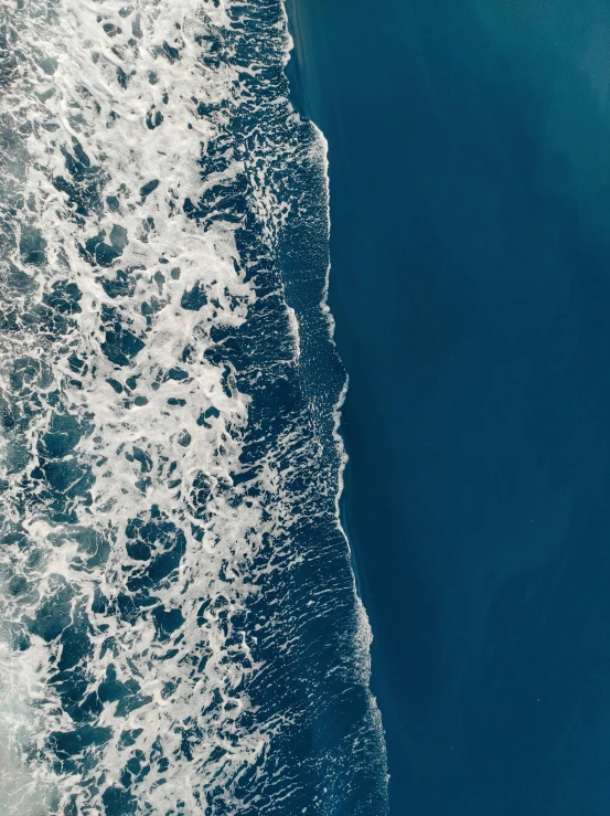 the ocean is foamy and clear for a backdrop