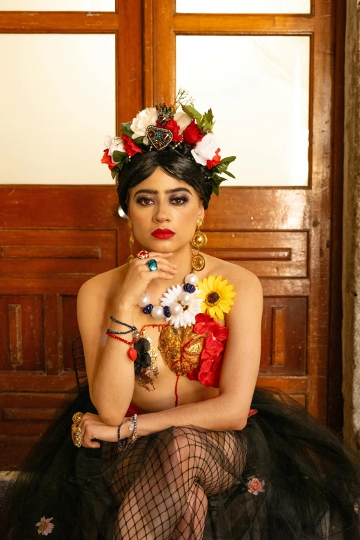 a beautiful woman wearing a skirt and headdress