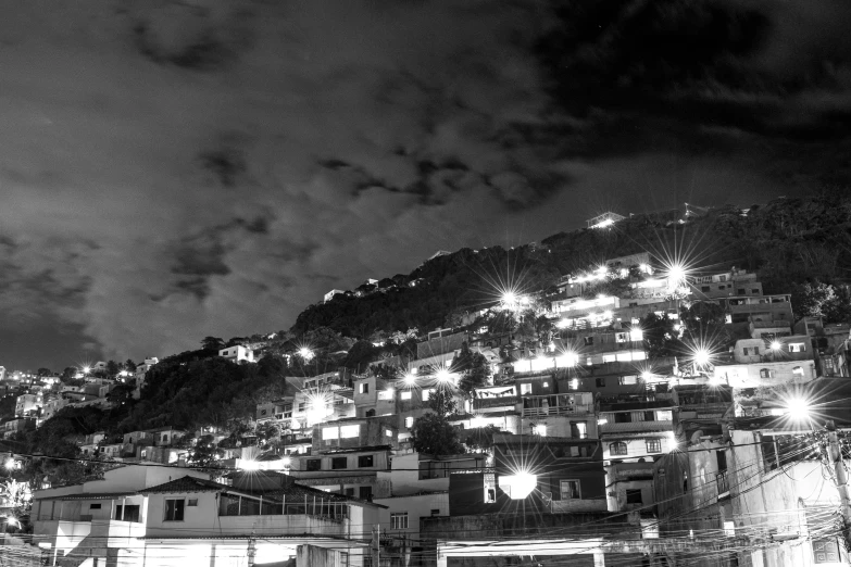 black and white po of a hillside with lights