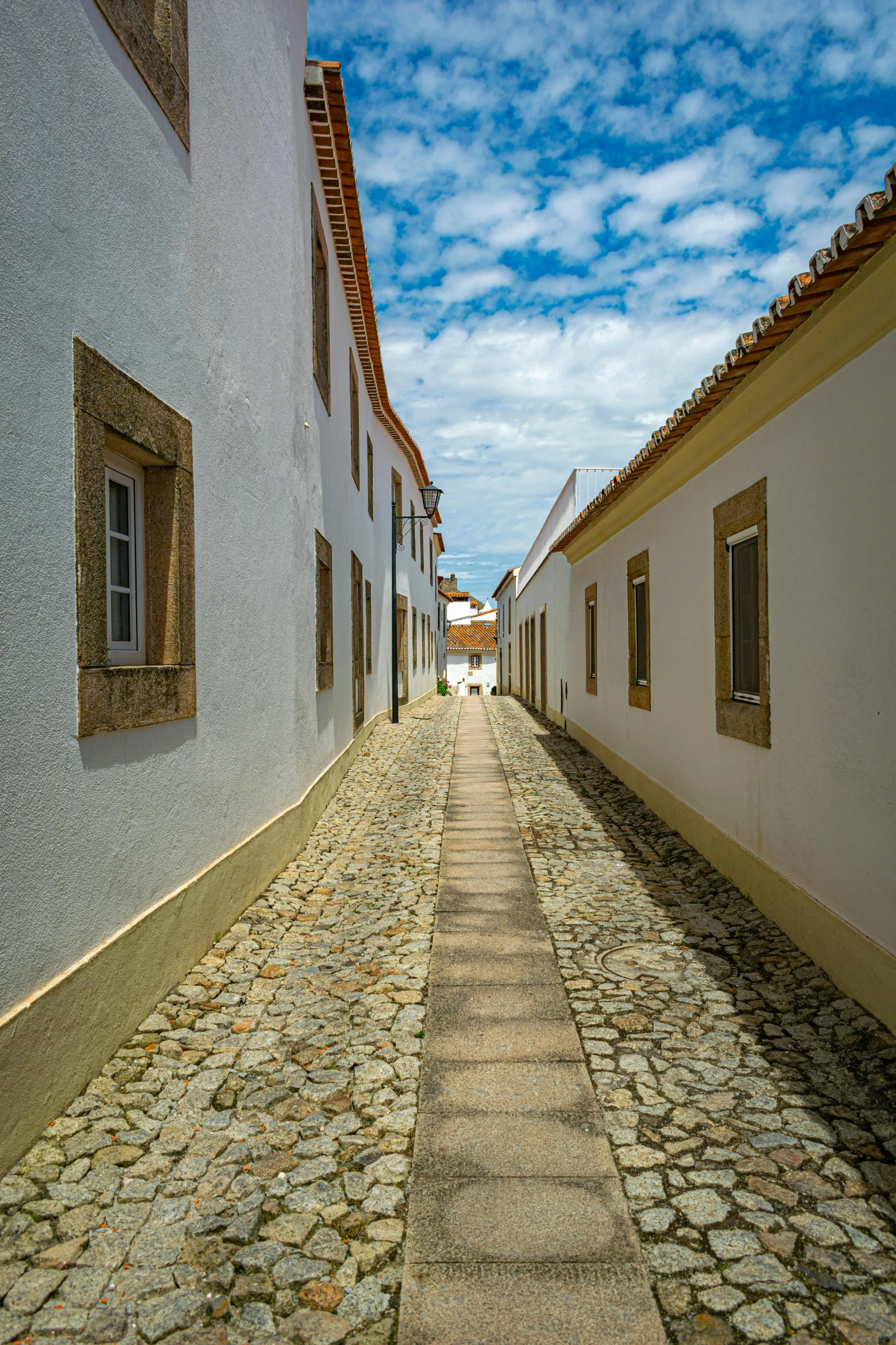 a cobblestone road in an european village