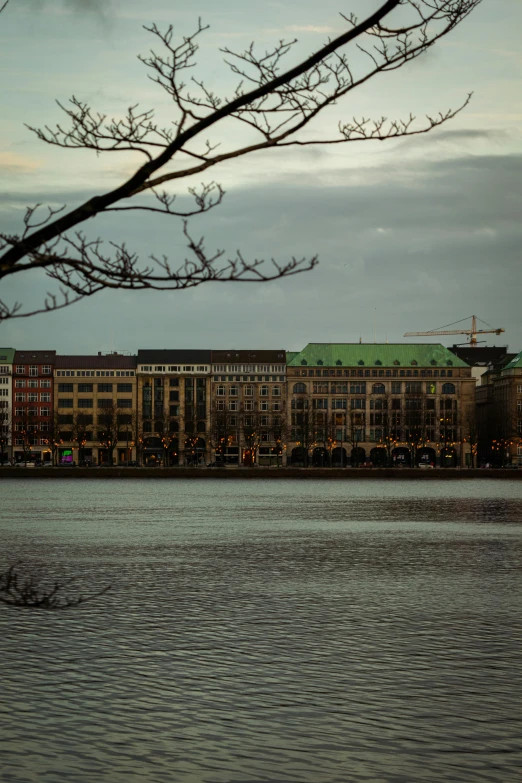 a large building in front of a large body of water