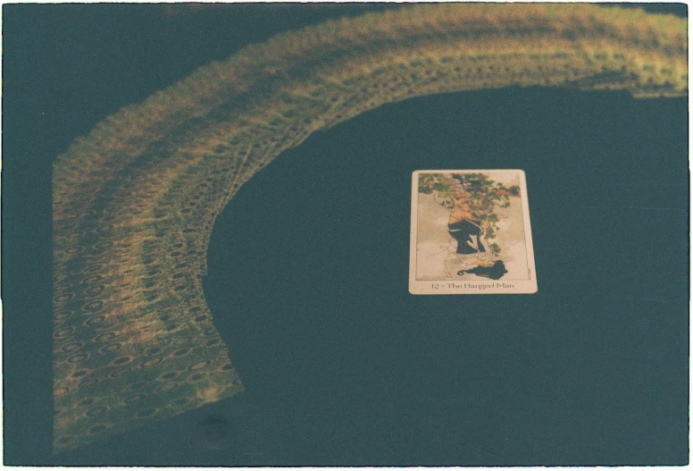 a card sitting on top of a table near a chair