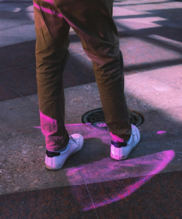 person standing on top of a fire hydrant with his feet up