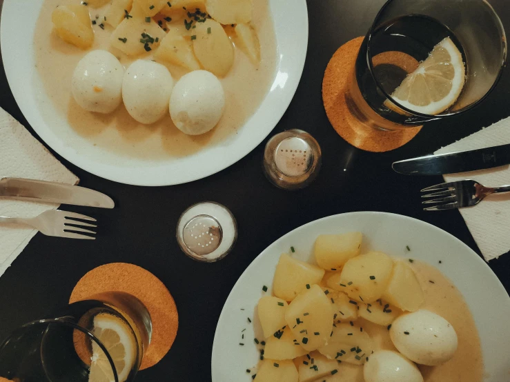 a bunch of plates of food that are on a table