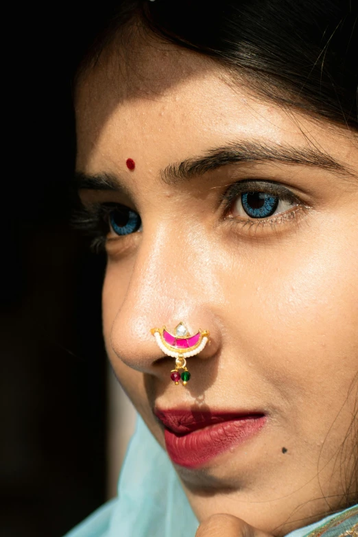 a woman with an unusual nose piercing in india