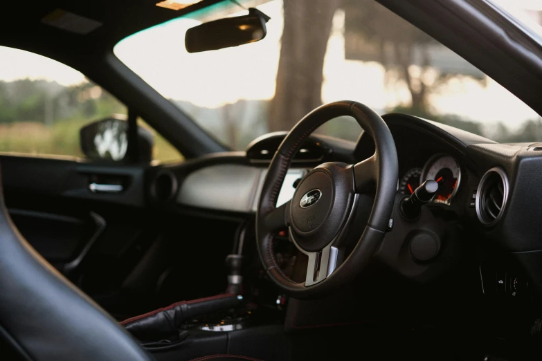 a s of a steering wheel and a dashboard from a vehicle