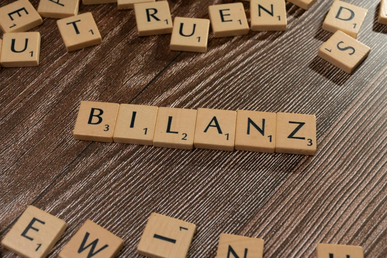 word made of scrabble tile spelling out the name blianz