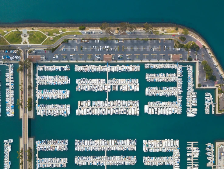 a dock filled with lots of parked boats