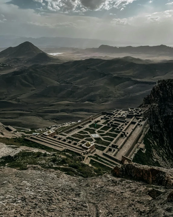 the road passes below the mountains as it turns to pass