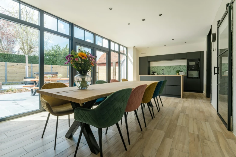 the dining room is very large and has a wood floor