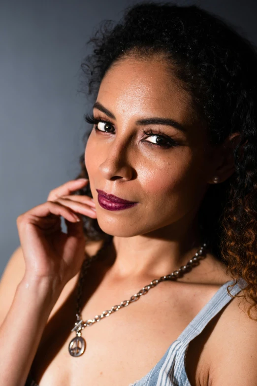 a beautiful young woman with large  posing for a portrait