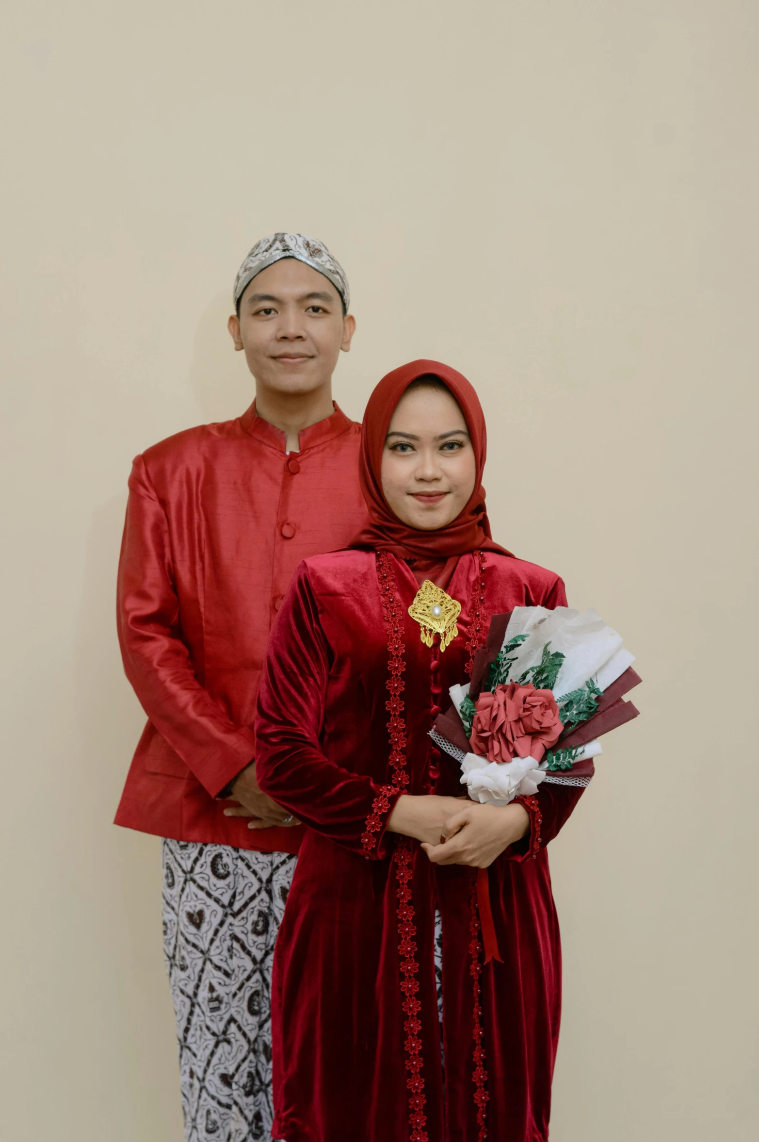 a couple posing for a po in traditional dress