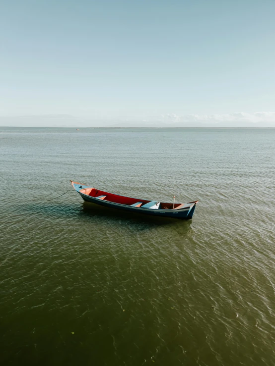 a boat is floating on the ocean water
