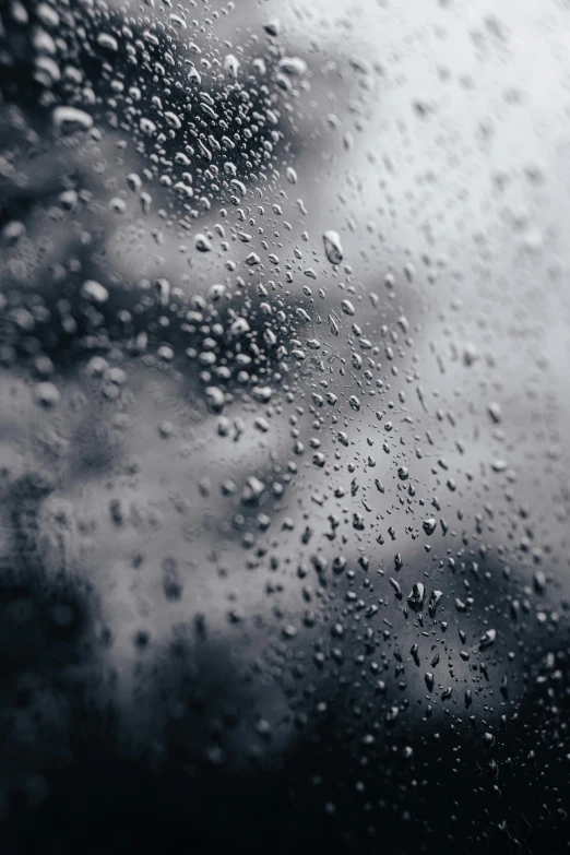 drops of rain on a window glass during the day