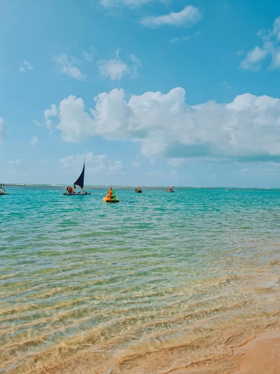 people in small boats out in the open water