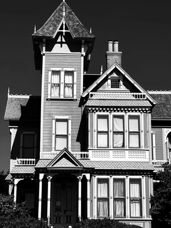 a large white house with many windows and a steeple