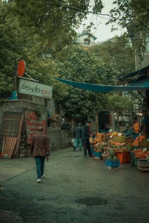 a small market with lots of produce on the street