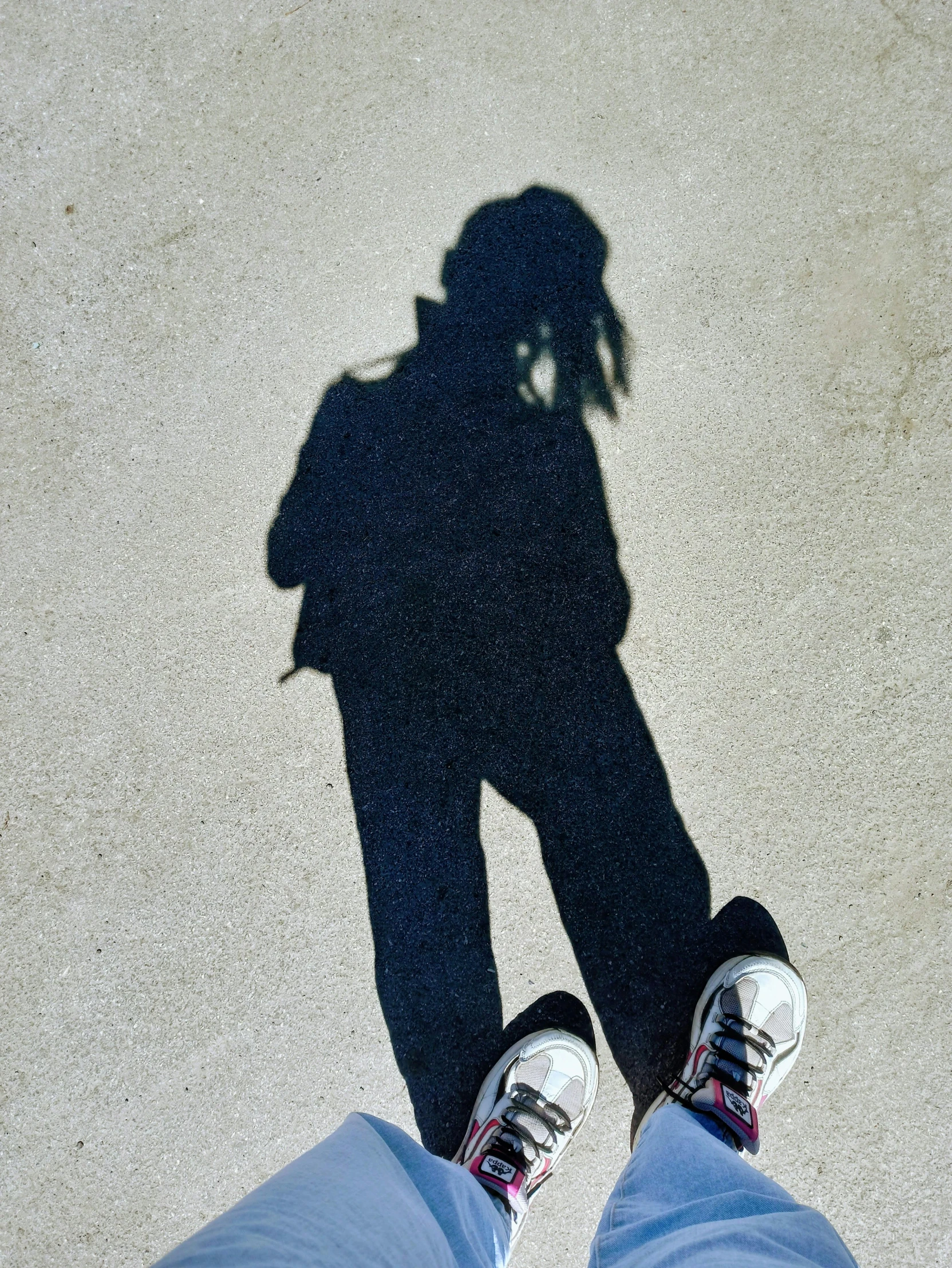 the shadow of two persons next to one another