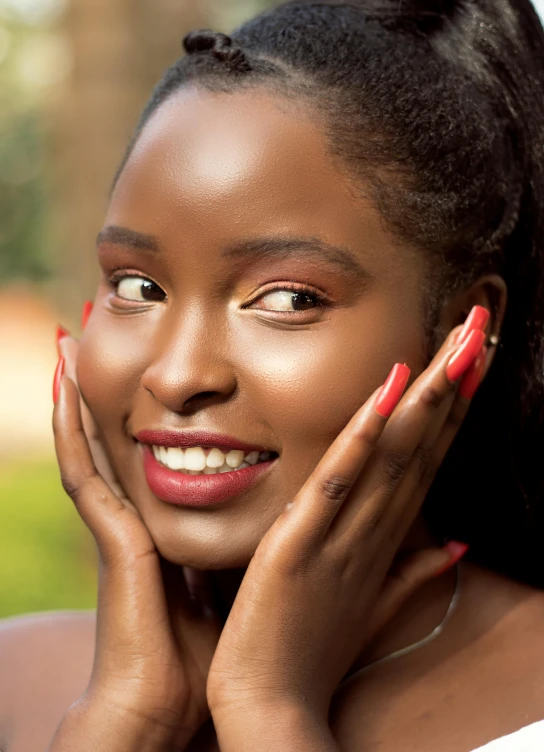 a woman with pink nail polish looking straight into the distance