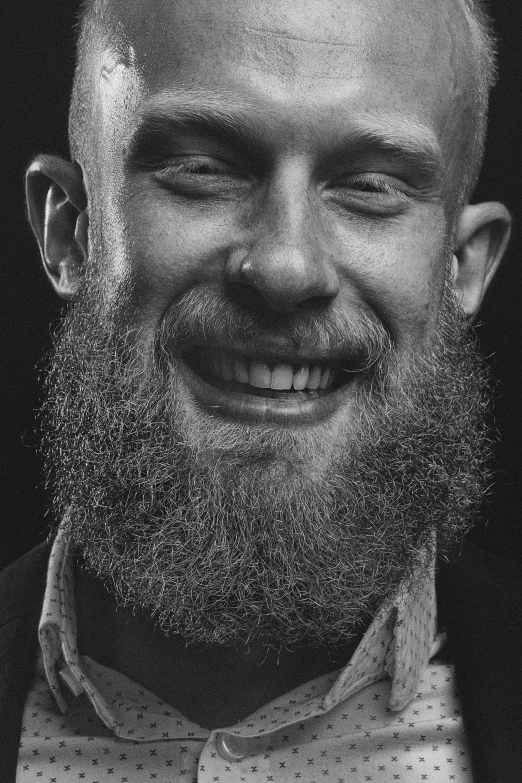 a man wearing a bow tie and smiling