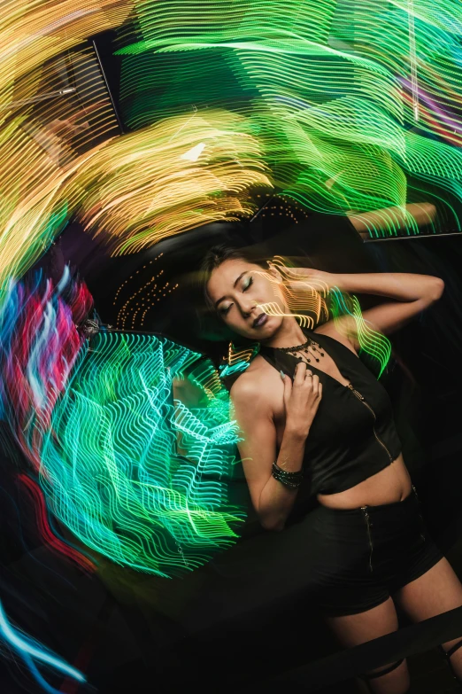 woman with dark underwear in colorful motion blur light