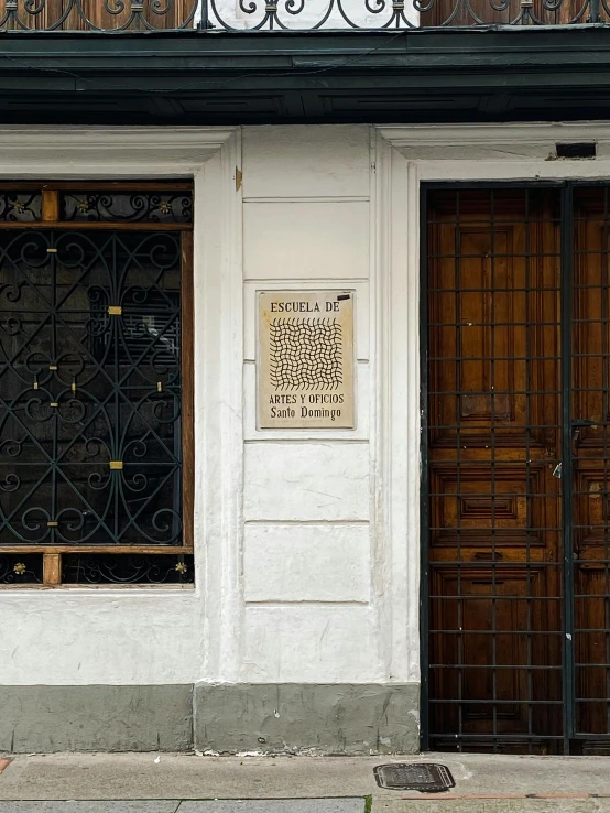 a wooden door and windows on a building