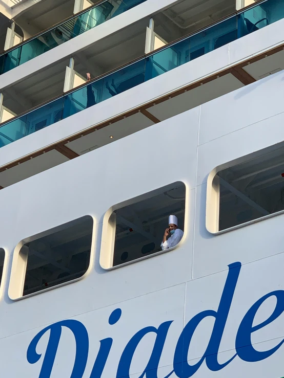 a passenger sits in a big ship looking out windows