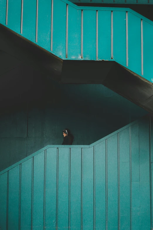 there is a person standing on the bottom of a building