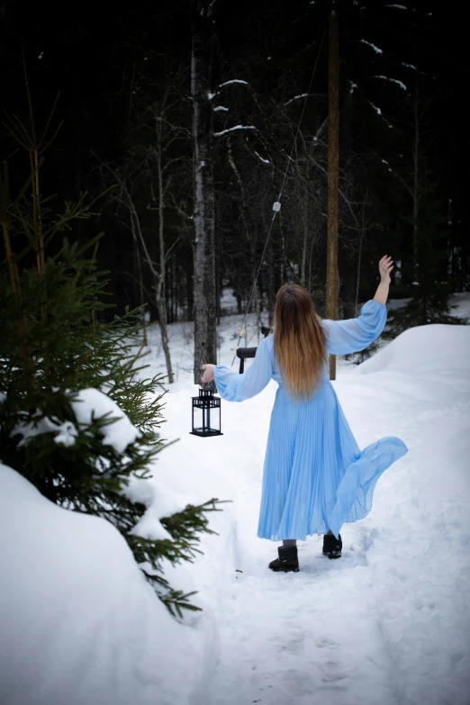 a woman with long hair in the snow