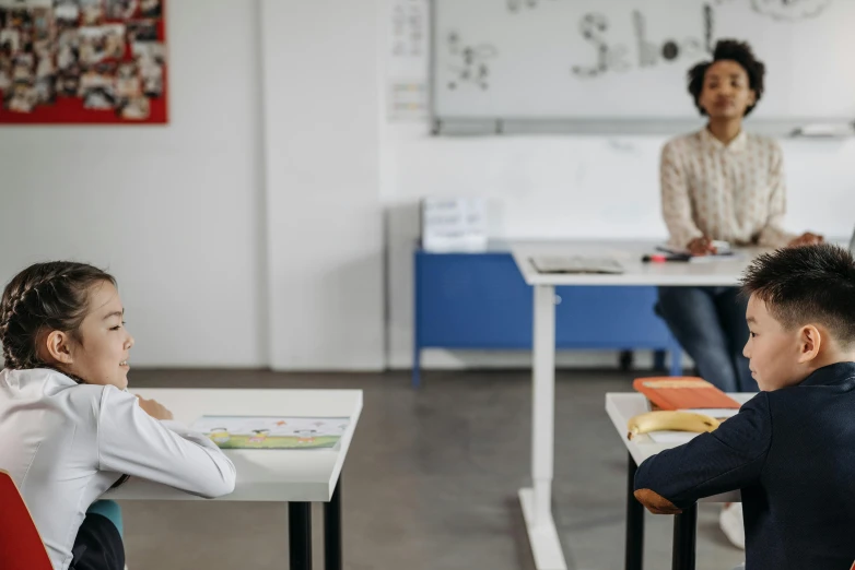 an image of children in the classroom doing school work