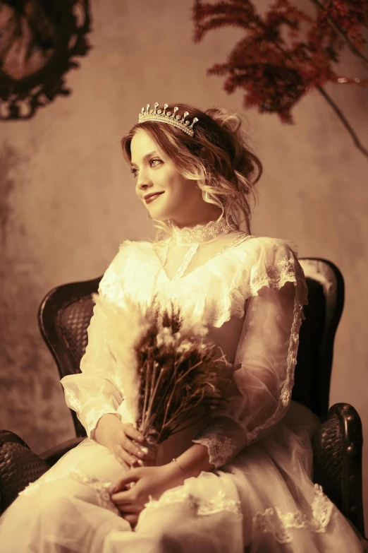 a young lady wearing a princess costume holds flowers