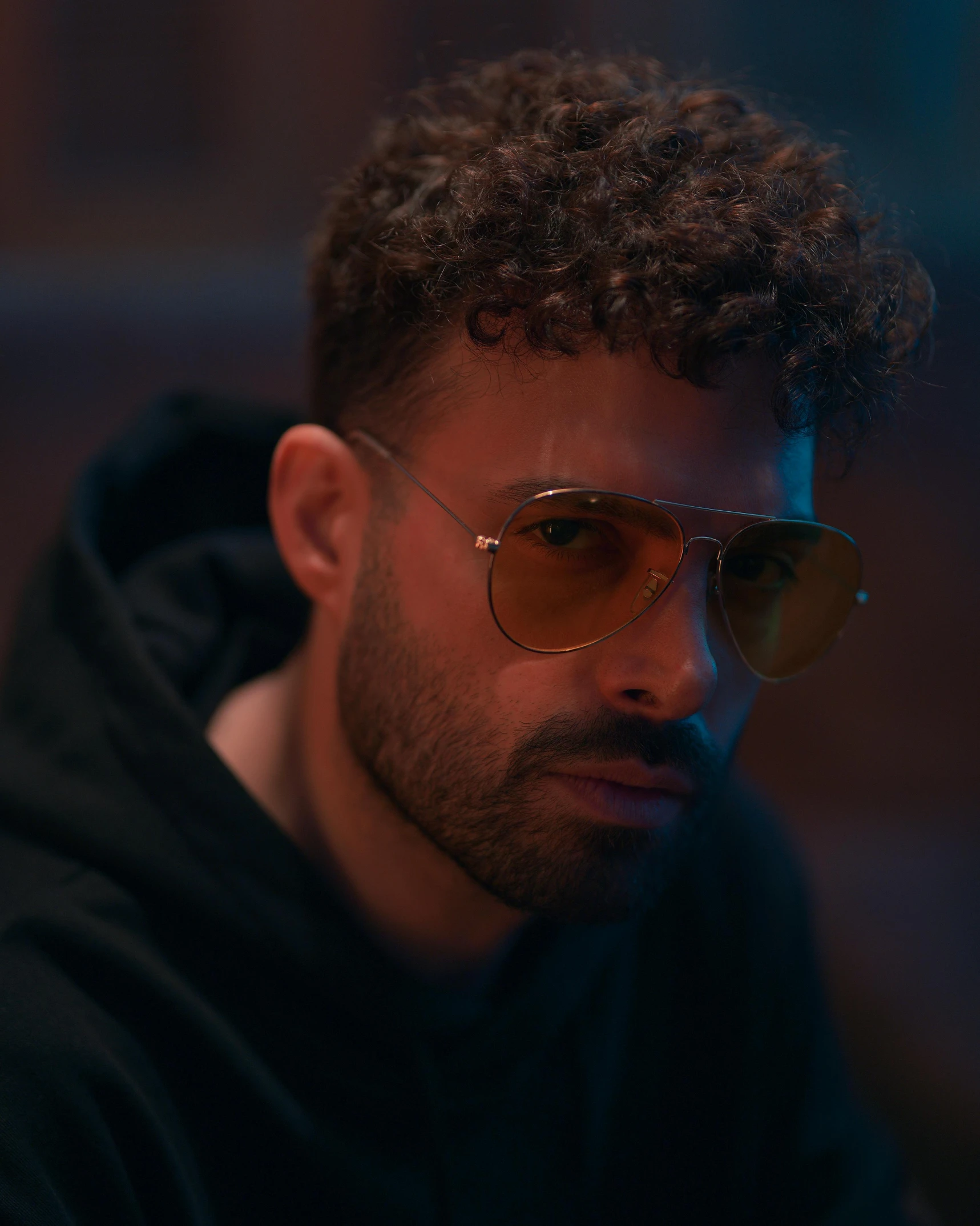 a young man is wearing the glasses he has on his face