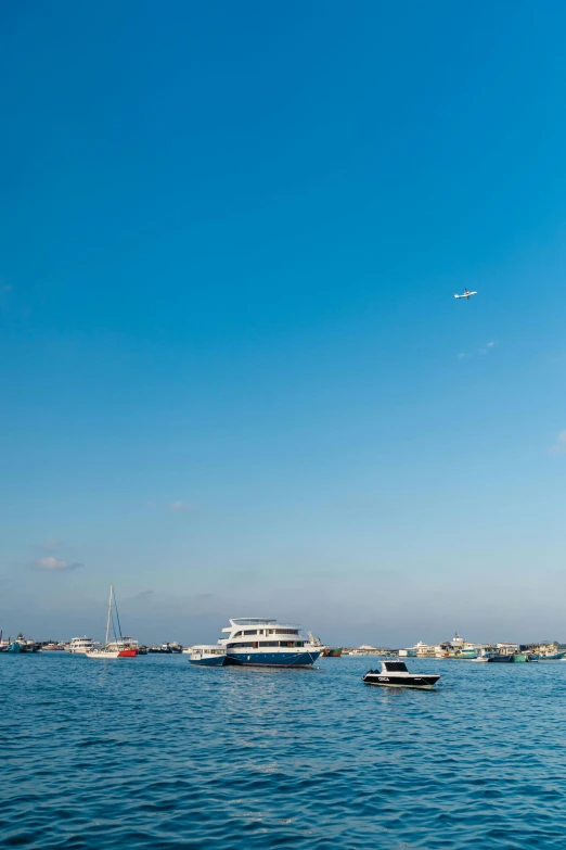 a couple of boats floating in the water near other boats