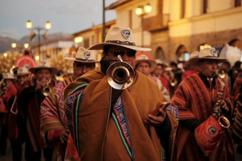 a group of men wearing costumes and playing instruments