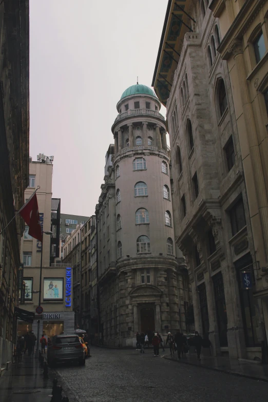 two buildings are seen from down an empty street