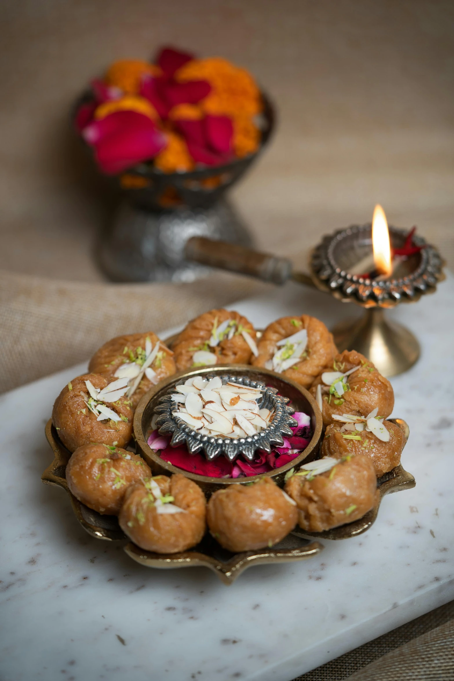 a plate with doughnuts and flowers in it with candles