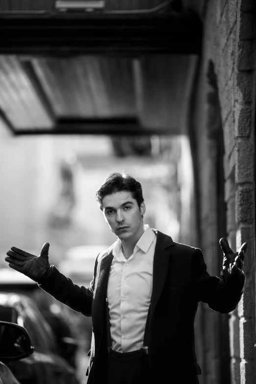 black and white pograph of a man in tuxedo