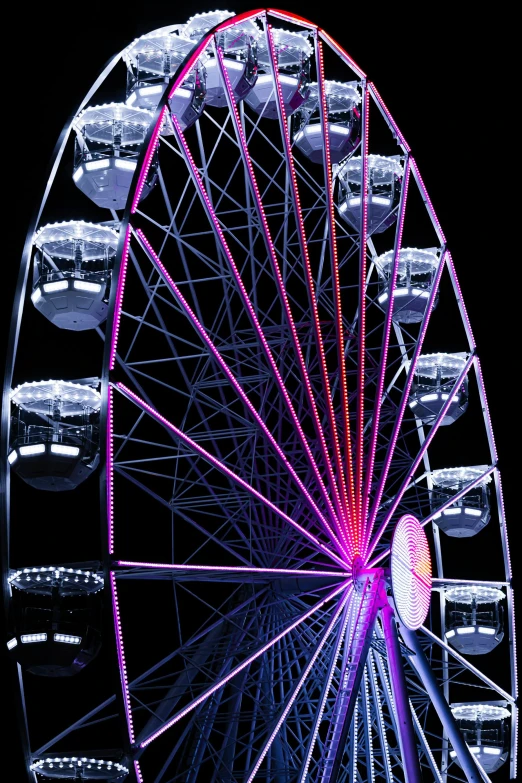 a big ferris wheel lit up at night