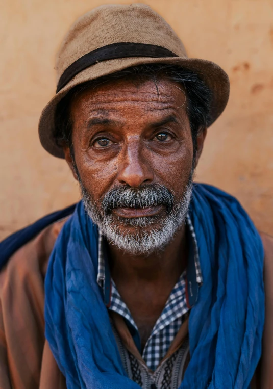 the old man with the gray hair and beard is posing for a po