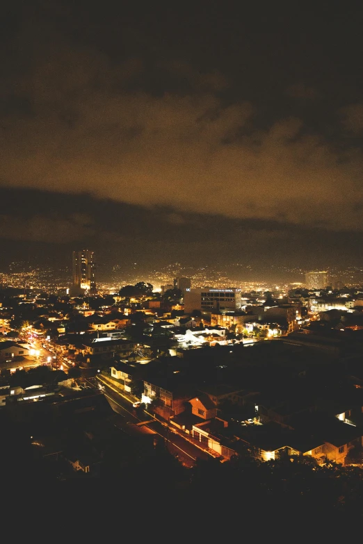 a city at night that has some buildings on it