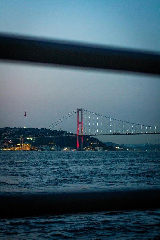 a view of a bridge in the distance on water