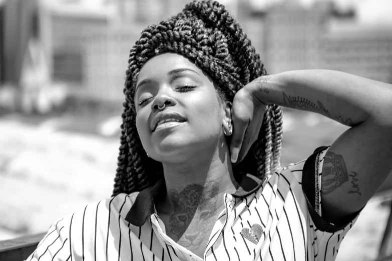 a black and white po of a woman on a bench