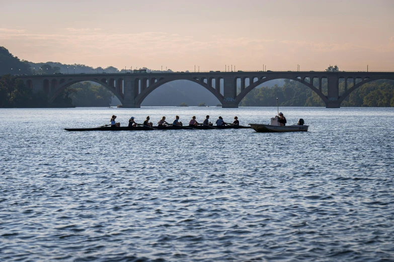 a group of people rowing on the water