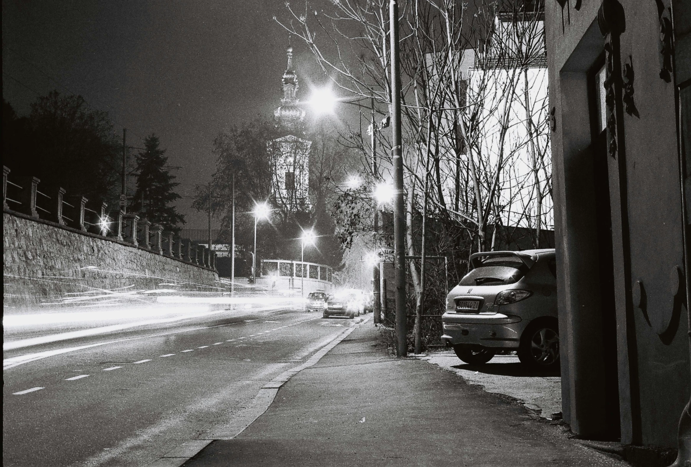 black and white po of a snowy street at night