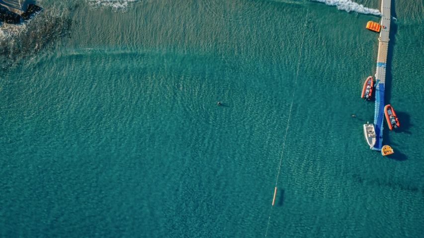 two boats floating next to each other on water