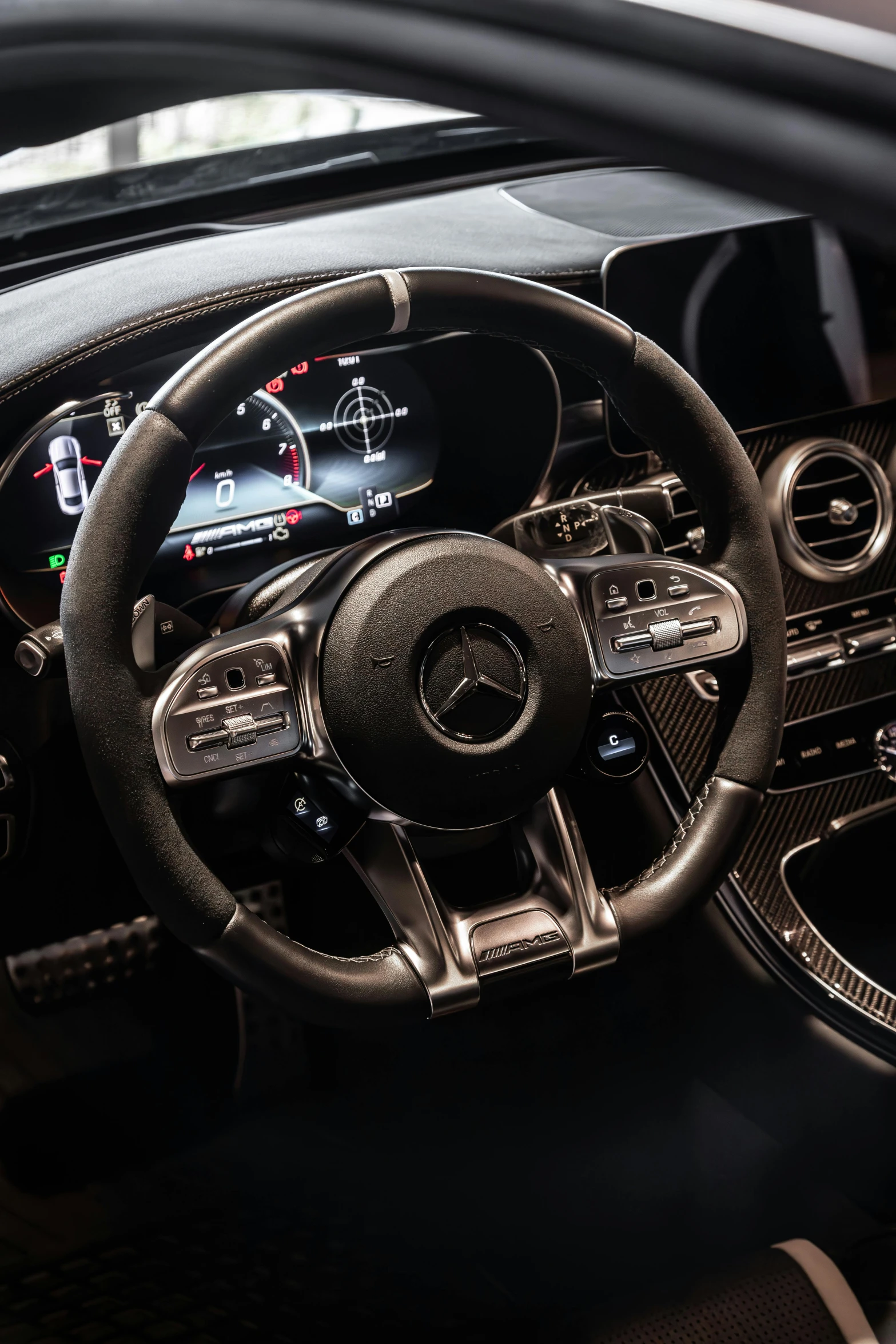 a car dashboard and controls with the center console light on