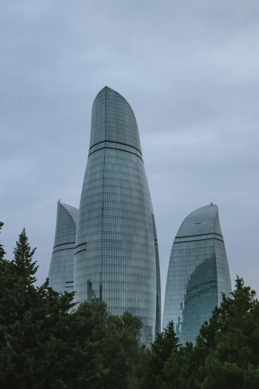 a very tall building with trees in front