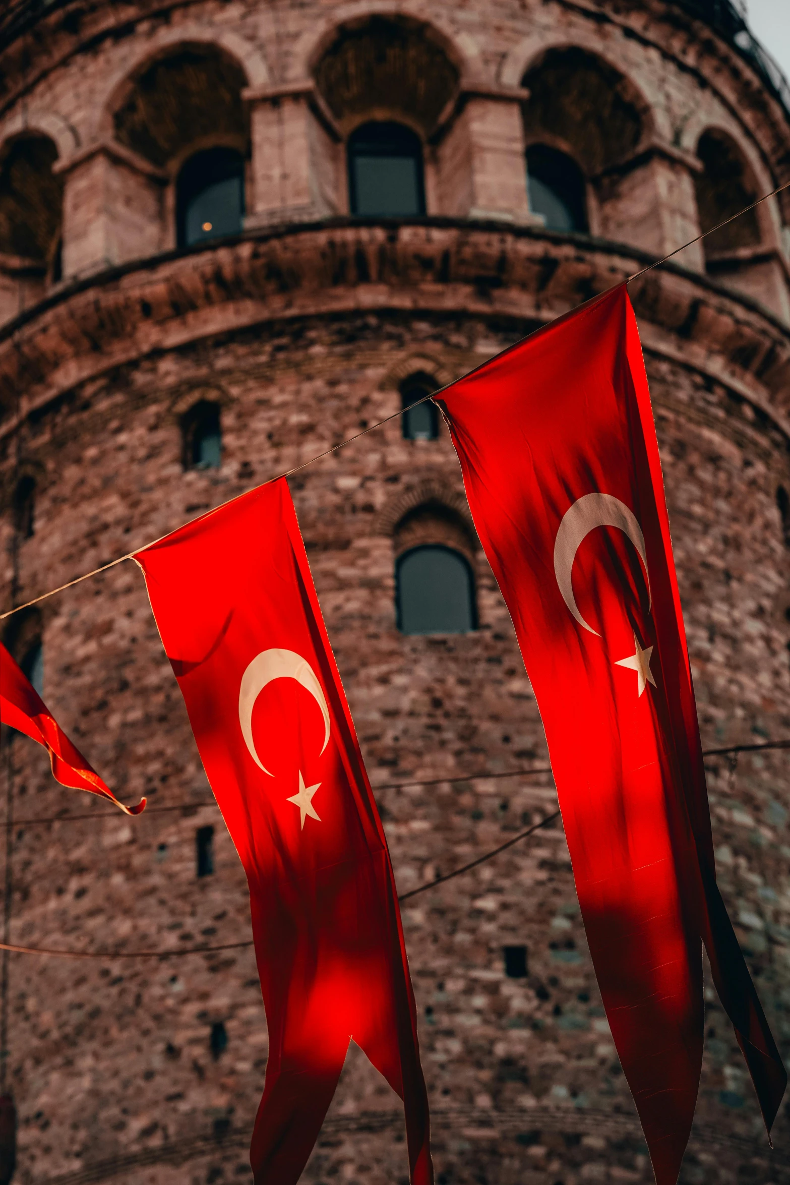 flags with a building in the background