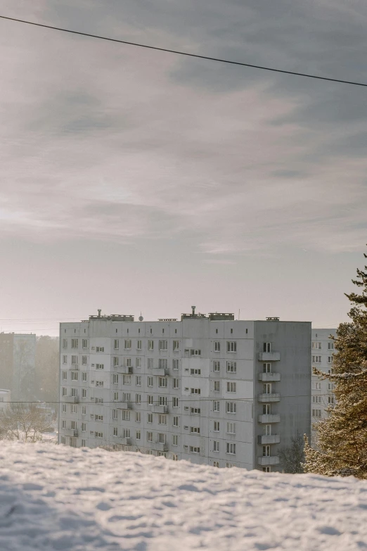 a tall building sitting on top of snow covered ground